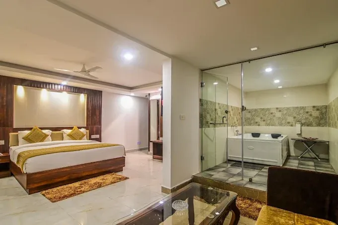 Comfortable guest room at De Falcon Goa Beach Resort featuring cosy bedding, air conditioning, modern furnishings and a relaxing atmosphere.