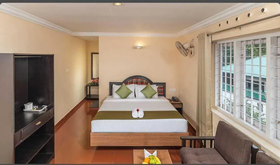Comfortable and well-appointed rooms at The Cardamom Thekkady feature cosy bedding, elegant interiors and modern amenities for a relaxing stay.