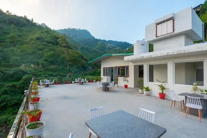 Open terrace at Hotel Creek Valley, Mussoorie, offering scenic mountain views, fresh hill-station air and a relaxing outdoor space for guests.
